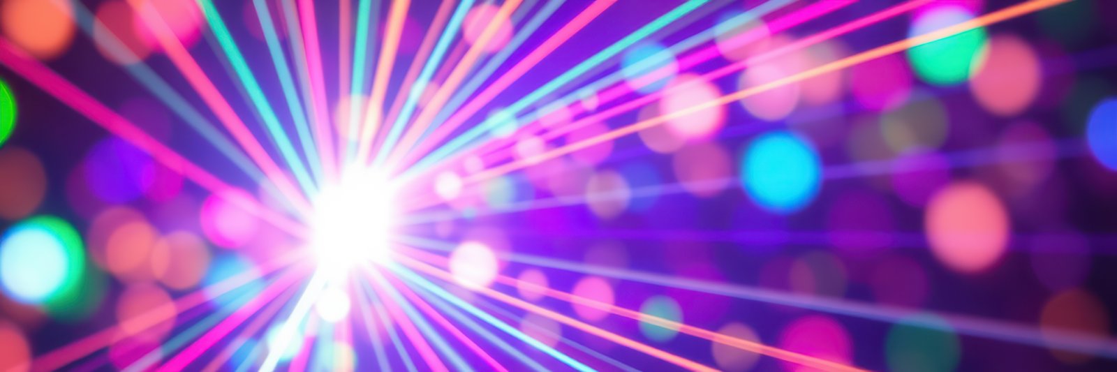 Colorful light beams create a vibrant atmosphere at a night event with disco balls and lively music